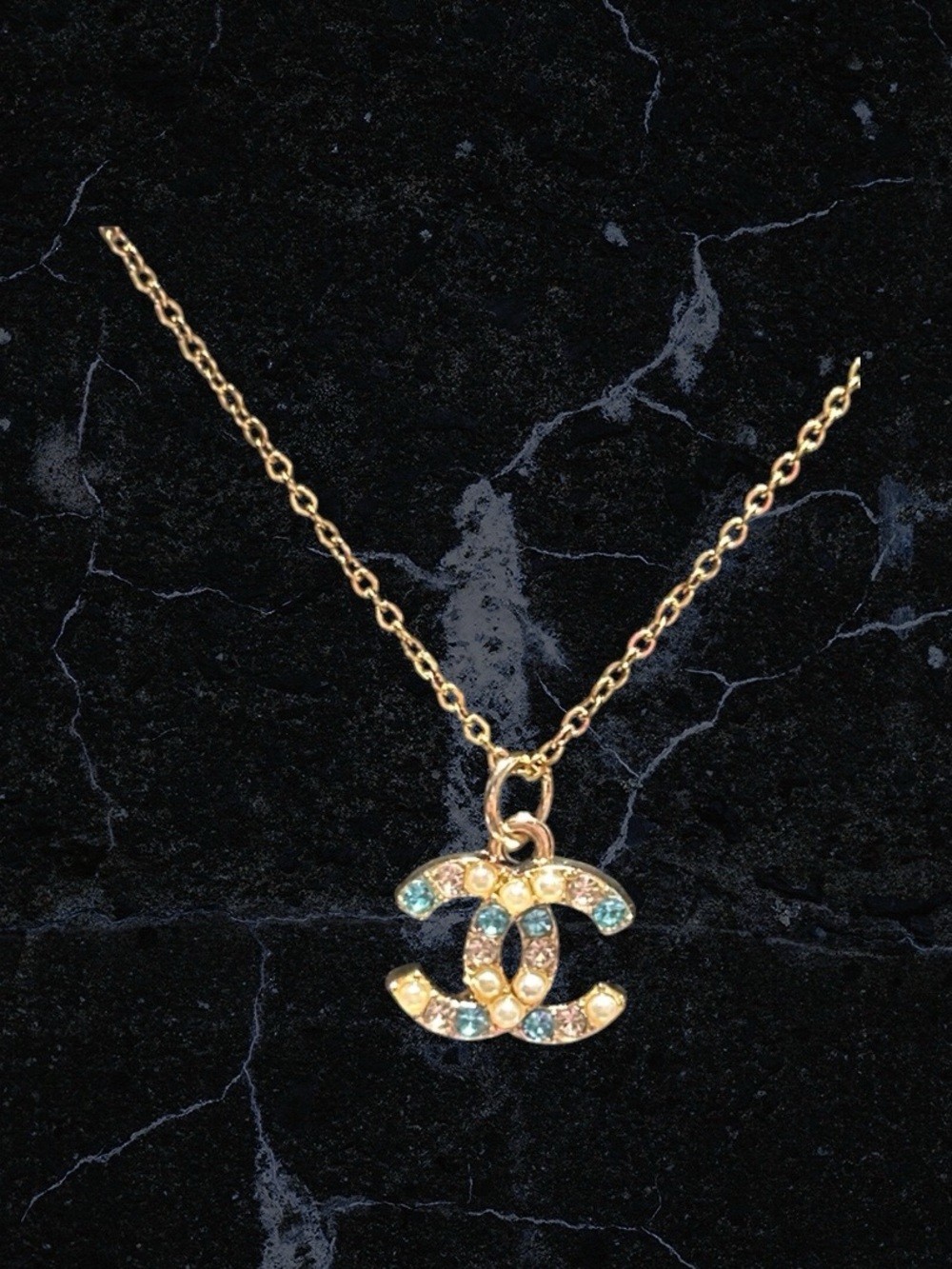Gold Logo Pendant Necklace with Blue Crystal Accents